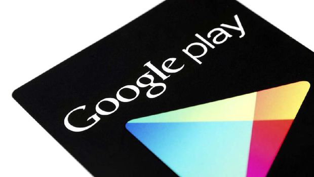 Edmonton, Canada - December 2, 2013 - A close-up shot of a Google Play gift card, sitting isolated on a white background. This gift card can be used towards the purchase of millions of books, songs, apps, and more from the Google Play store.